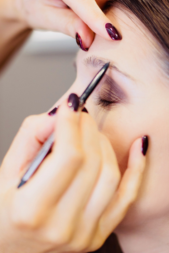 Eyebrow enhancing make-up being applied